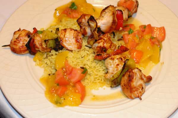 Rice in a platter topped with meat