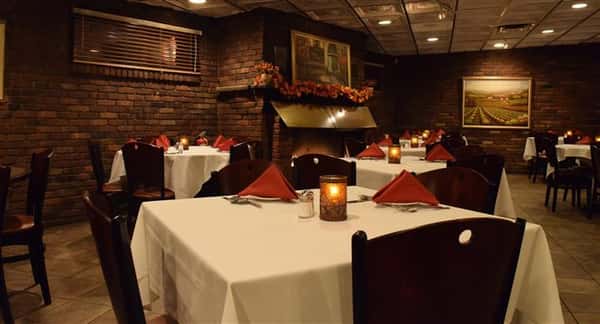 Dining area of restaurant with uniformly folded napkins