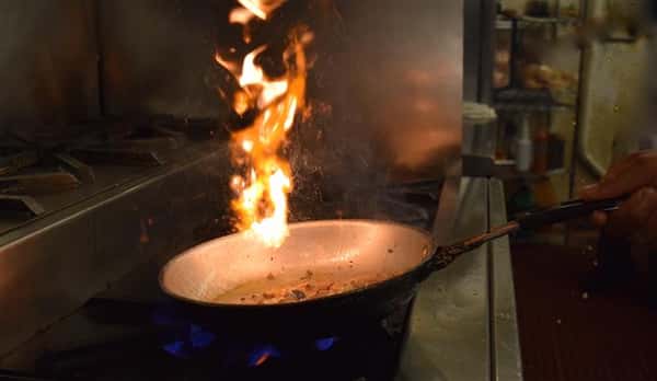 Flaming hot pan with fire