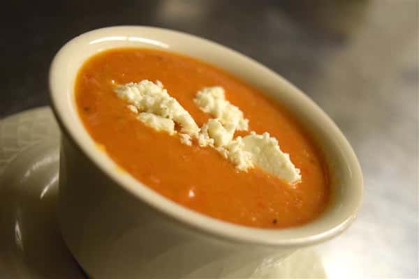 Soup with crumbles inside of it