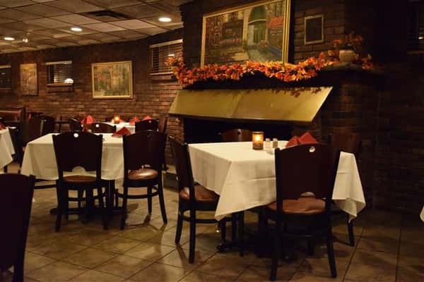 Dining area of restaurant with painting on the wall