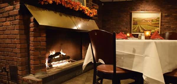 Chair with fire place in the background