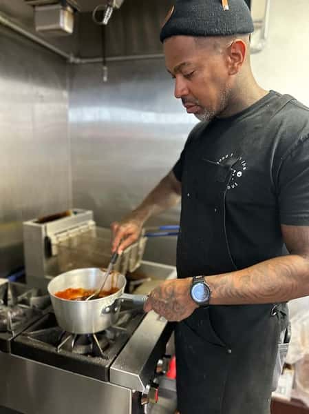 Aaron aka "The Sauce God" Making fresh sauce