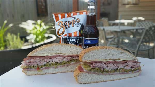 Sandwich with potato chips and soda