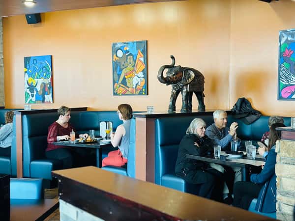 Customers eating at restaurant