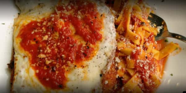 Breaded, topped with marinara sauce and melted mozzarella cheese