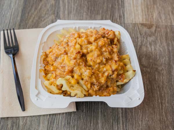 Bacon cheese fries served in a to-go container