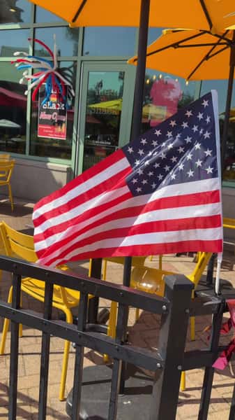 American flags mounted on the restaurant's outdoor railing