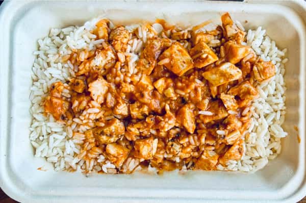 Glazed chicken bites served over rice
