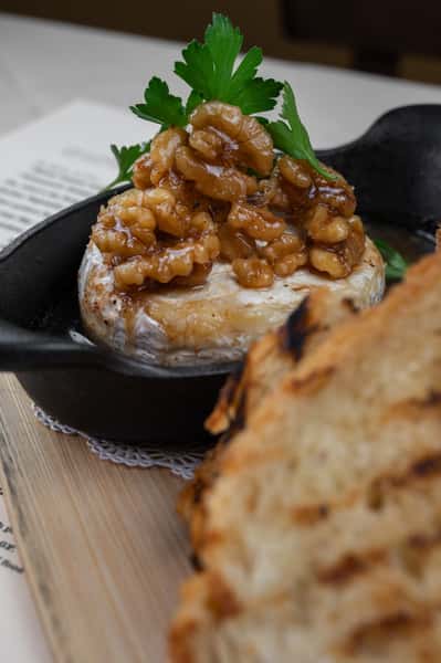 Skillet baked brie, maple walnut honey, Maldon flake salt, grilled sourdough toast points