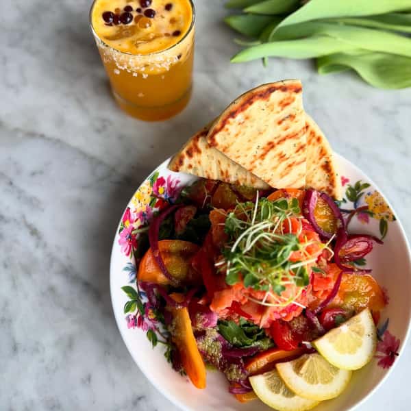Smoked Salmon Salad with heirloom tomatoes, hibiscus pickled onions, and preserved lemon vinaigrette