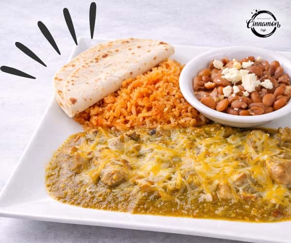 Traditional Salvadoran breakfast plate with eggs, rice, refried beans, cheese, and warm bread.