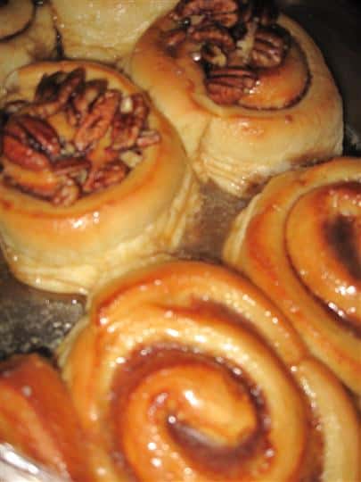 cinnamon rolls topped with pecans