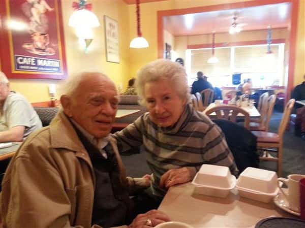 elderly couple posing for picture