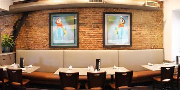 Dining area with 2 painting on the wall