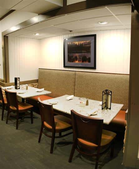 Dining area with a painting on the wall