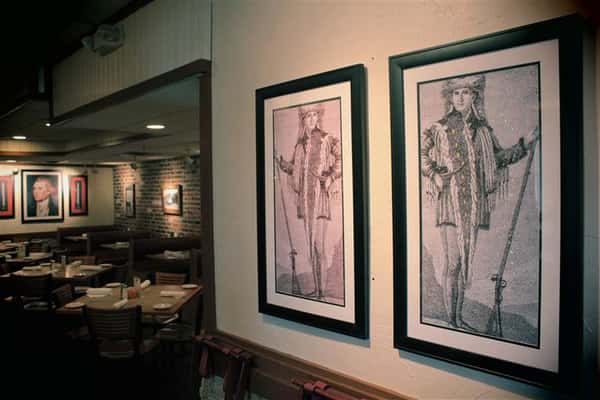 Paintings next to dining area