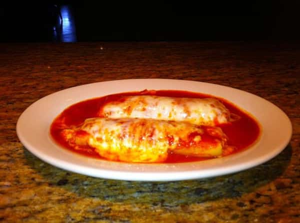 Hot dish covered in melted cheese and smothered in tomato sauce
