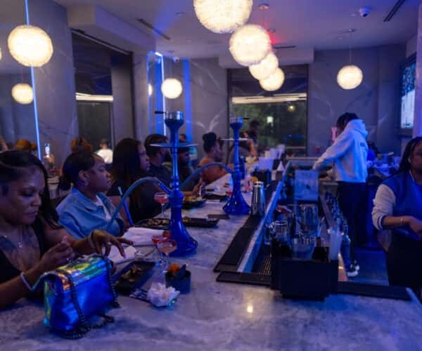 Guests enjoying the hookah bar at Weezy's