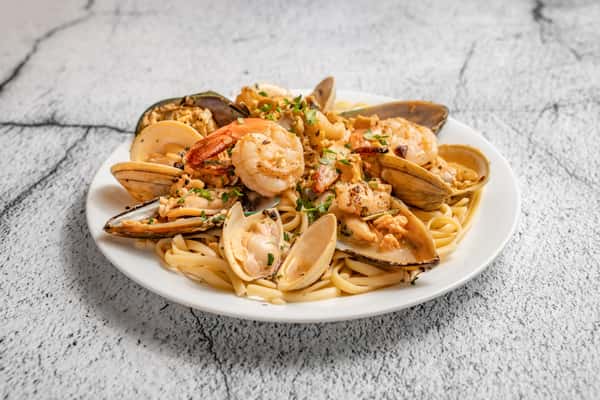 Lobster Tail, Shrimp, Clams, Mussels Over Linguine