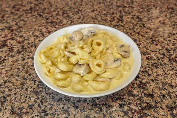 Cheese Tortellini Alla Crema with Mushrooms
