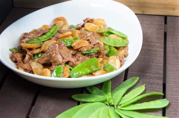 beef with snap peas over noodles