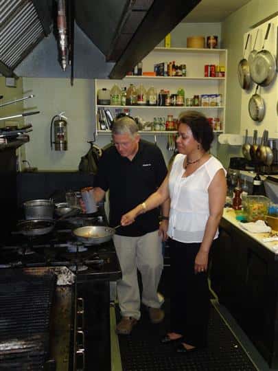 People in the kitchen cooking