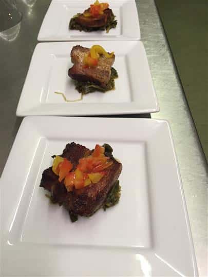 Beef on a platter topped with pepper skins