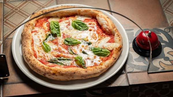 neapolitan-pizza-garnished-with-fresh-basil