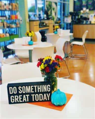 Inside seating with a sign that says "do something great today".