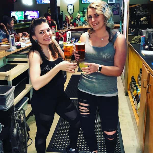 People with drinks inside restaurant