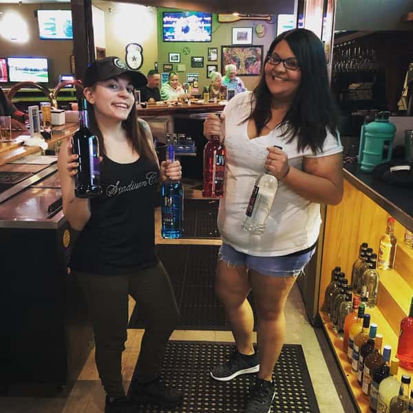 People with drinks inside restaurant
