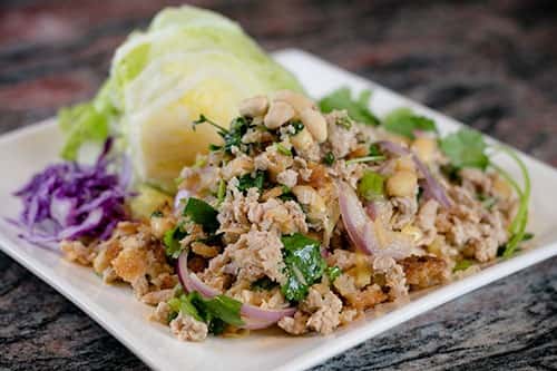 Crispy rice, ground pork, ginger, onion, cilantro peanuts & lime juice salad with lettuce on the side.