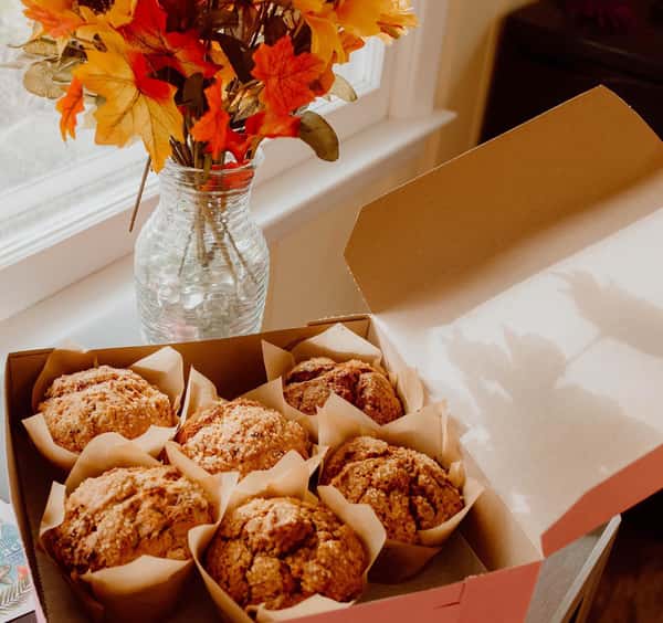Open box of muffins