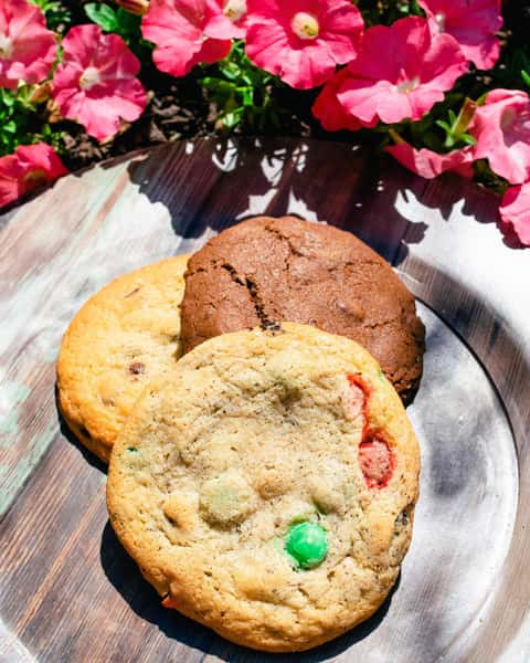 Close up of three cookies on a wood table