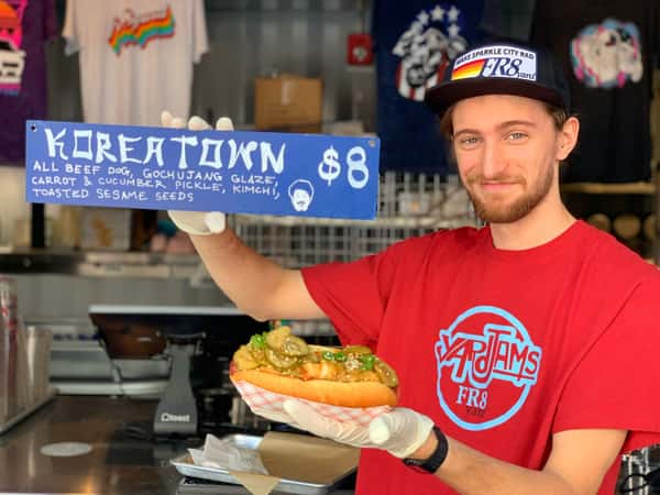 Fr8yard employee holding up Korea Town sign