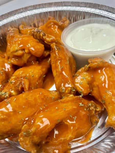 Enjoy our crispy, golden-fried wings--baked at 500 degrees to perfection first to ensure that unbeatable crunch! Each order typically inludes 10 wings, but portions may vary slightly based on weight. Elevate your experience wiht on of our delicious sauce options, or mix and match two for a small fee. Come back for more--your taste buds with thank you!