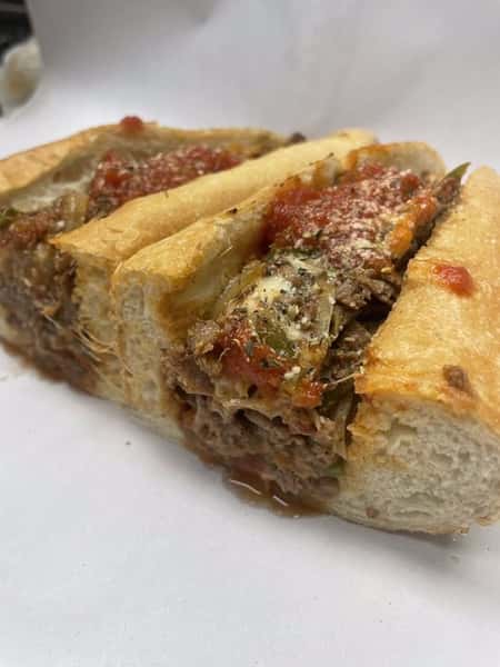 12 oz thinly sliced sirloin sauteed with Green Peppers and sweet onions, melted provolone and finsihed off with our savory marinana.