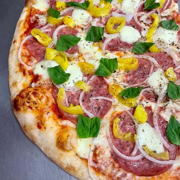 Experience the Italian masterpiece--an expertly balanced blen of hard Genoa salami, sweet onions, tangy banana peppers, fresh mozzarella, and freshly minced garlic, all topped with fragrant basil. It's a flavor symphony you'll savor in every bite!