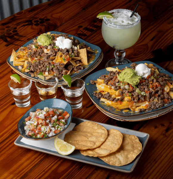 Assortment of Summer of Soccer Specials. Margarita, carne asada fries, fresh ceviche and tequila shots.