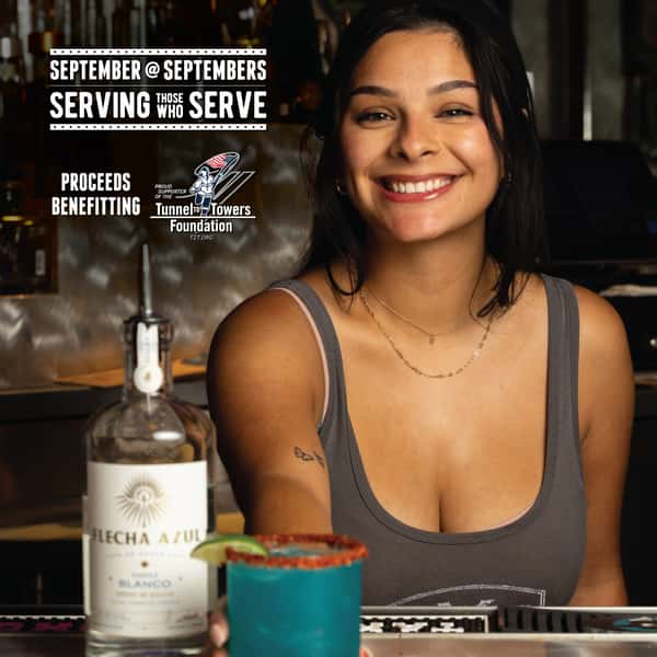bartender serving a drink for september at septembers