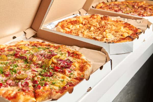 Old Shawnee Pizza's in cardboard boxes.