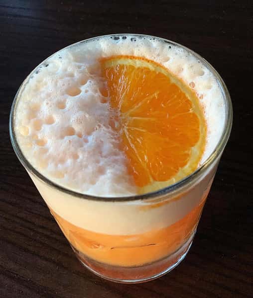 cocktail with an orange wedge