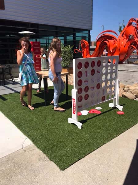 people playing giant connect four