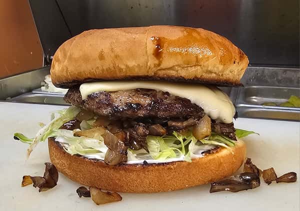 mushroom swiss burger with grilled onions and lettuce
