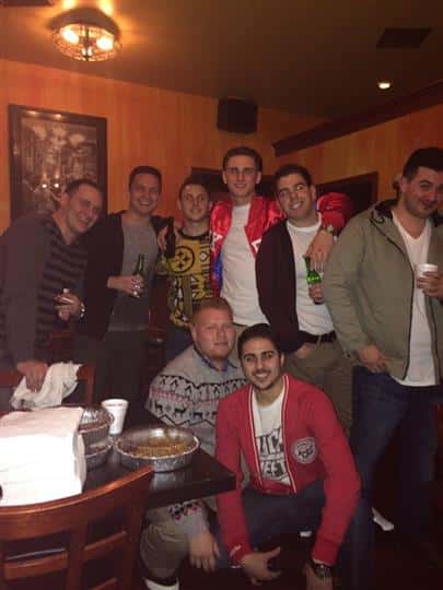 a group of guys smiling together