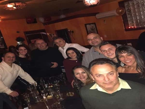 10 customers smiling at the bar