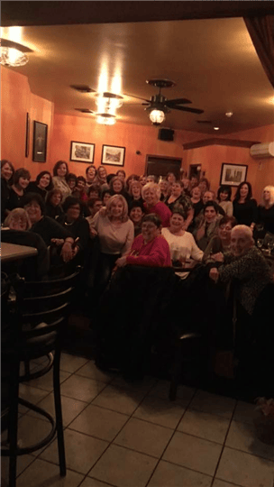 a big group of people smiling for the camera