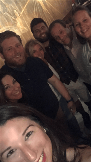 a selfie of 7 happy customers
