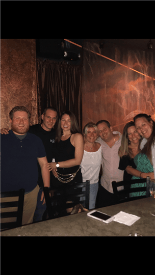 7 happy customers smiling together